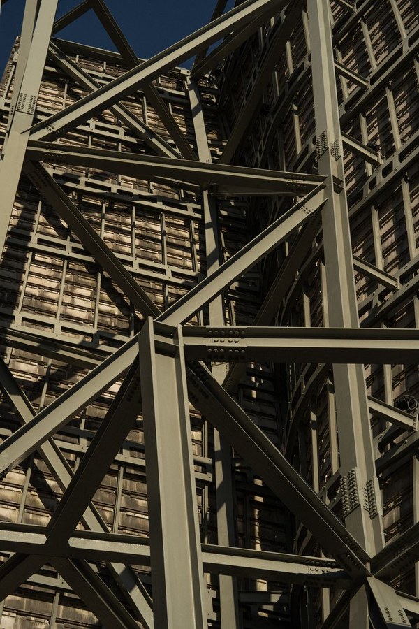 Workshop hands crafting architectural model with precision tools